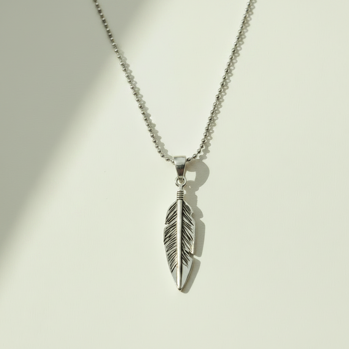 Oxidized feather pendant necklace with silver-tone feather charm and loop bail