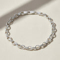 Silver chain bracelet on a white background