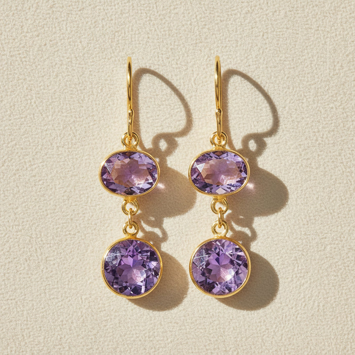 Gold-tone bezel double-drop earrings with two round purple amethyst stones