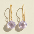 Gold-tone drop earrings with faceted pink amethyst briolette