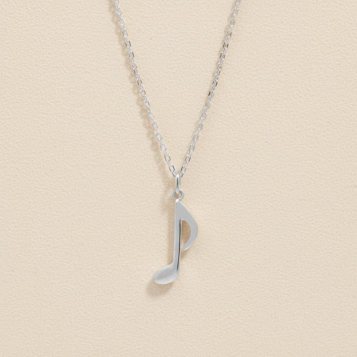 Silver-tone chain necklace with quarter note charm pendant