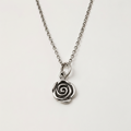 Silver-tone rose swirl pendant on short chain with round clasp