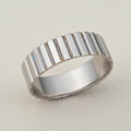 Ribbed band ring in silver tone with vertical ridged texture