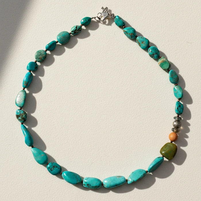 Turquoise oval bead necklace with silver-tone clasp