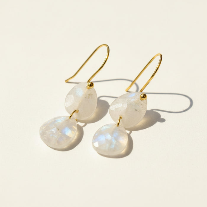 Gold-tone drop earrings with moonstone double teardrop stones on hooks