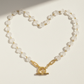 Clear crystal beaded necklace with gold-tone round pendant