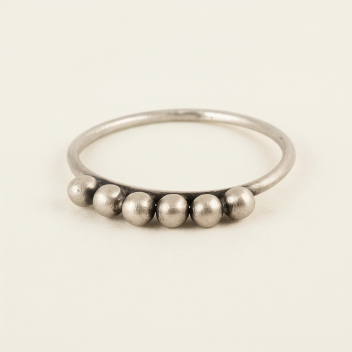 Six-ball granulated ring with six silver spherical beads on a slim band