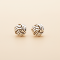 Silver-tone twisted knot stud earrings with round braided design