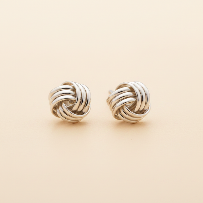 Silver-tone twisted knot stud earrings with round braided design