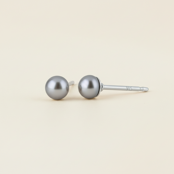 Gray pearl stud earrings with round pearl tops and metal post backs