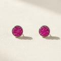 Round druzy stud earrings with pink-magenta stone, silver-tone bezel, post-back closure