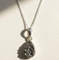 Silver-tone teardrop druzy pendant necklace with faceted sparkle-stone drop on chain