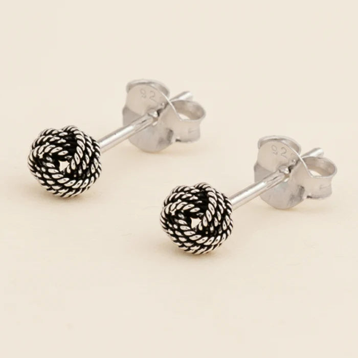 Small rope-knot stud earrings with textured silver-tone round balls