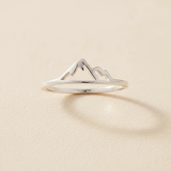 Silver mountain ring with raised peak and snowcap design