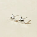 Mountain stud earrings with snow-capped peaks, silver-tone metal.