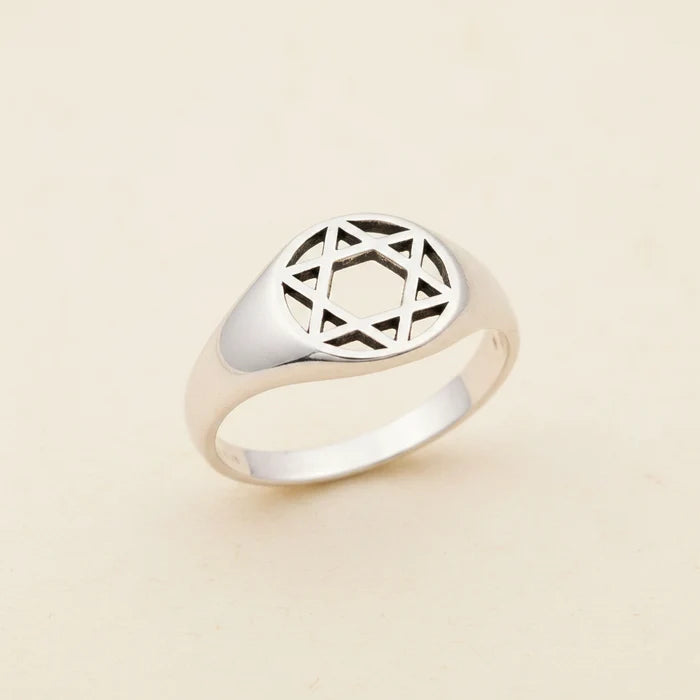 Sterling silver tone signet ring with engraved geometric star motif top