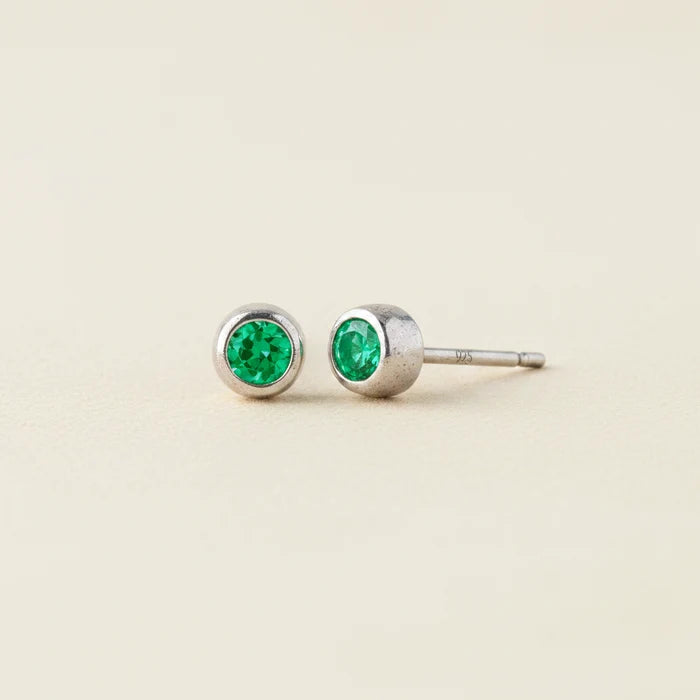 Tiny birthstone stud earrings with round green emerald CZ in silver-tone settings