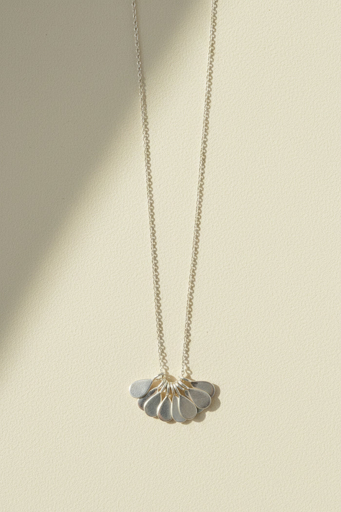 Silver teardrop flower pendant necklace with thin chain