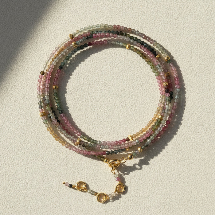 Multistrand tourmaline bead wrap bracelet/necklace with gold-tone toggle clasp and charm