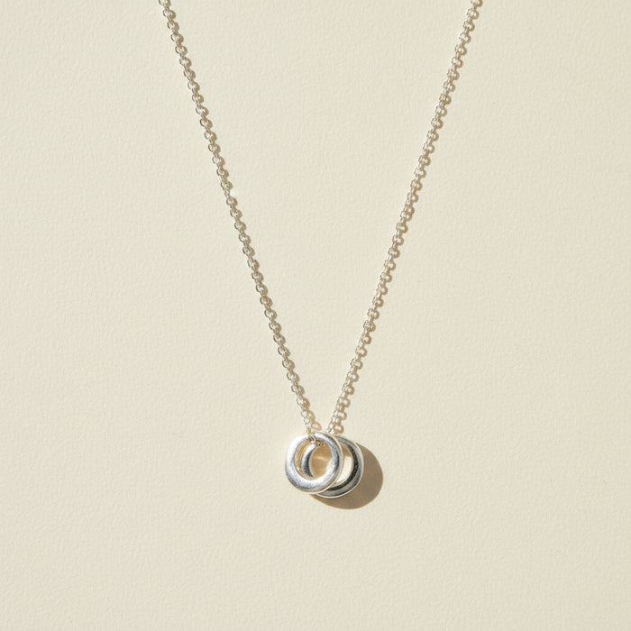 Two-circle pendant necklace with silver-tone linked rings