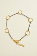 Two-tone link bracelet with small circular charms and gold rings