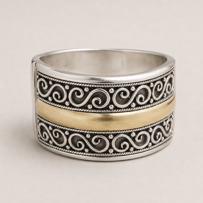 Two-tone filigree band ring with engraved scroll pattern, silver and gold-tone