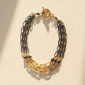 Two-tone hammered chain bracelet with gold clasp, linked silver and gold sections