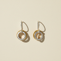 Two-tone small hoop earrings with stacked circle charms, gold and silver rings