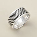 Wide silver-tone grooved band ring with oxidized ridged stripes