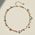 Gold-tone freshwater pearl choker necklace with multicolor beads and dangling charms