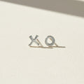 XO stud earrings with X and O metal letters, silver-tone finish