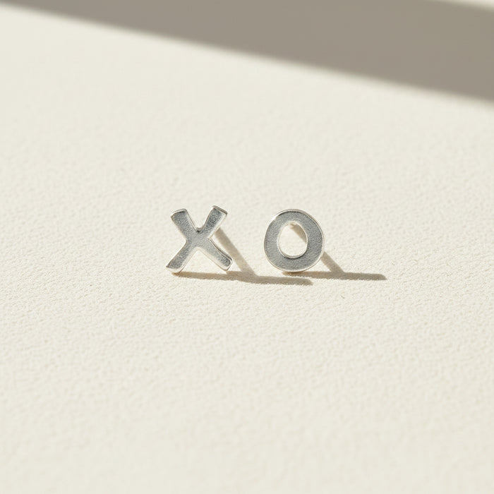 XO stud earrings with X and O metal letters, silver-tone finish